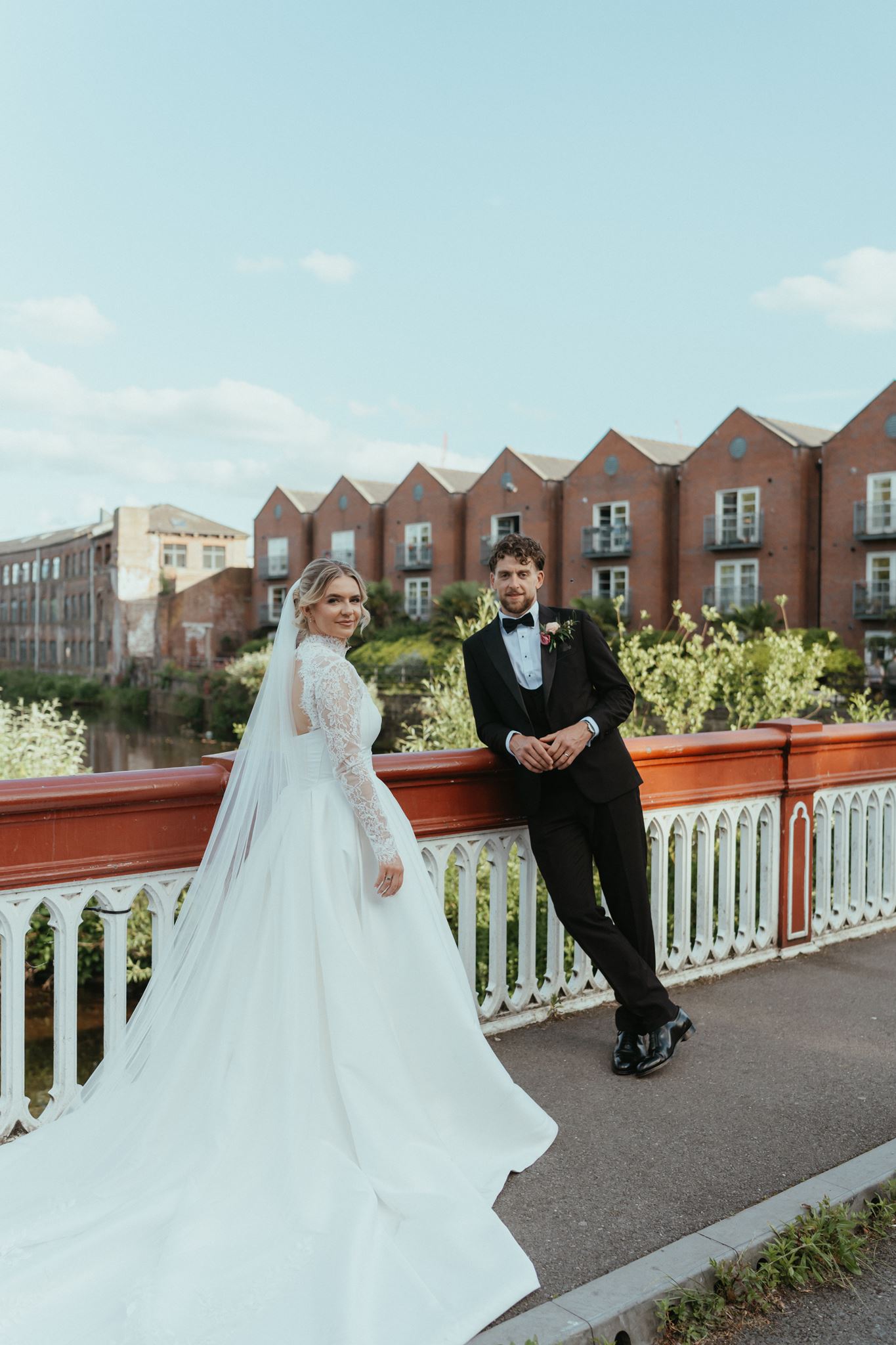 Bride and groom on the bridge by the old mills